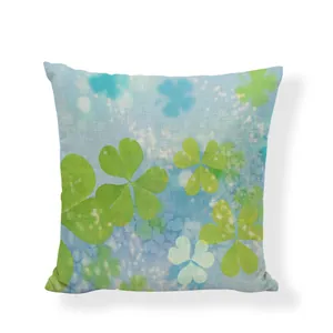 Macro view of green clover pattern on linen pillowcase for sofa home interior decor