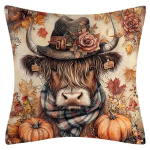 Autumn highland cow linen cushion cover printed with rustic pumpkins and leaves