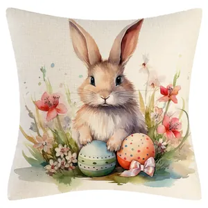 Osterkissenbezug mit Aquarell-Hasen und bunten Eiern als festliche Wohndekoration