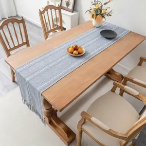 Nordic light blue cotton linen table runner with elegant white striped jacquard and fringe detail.