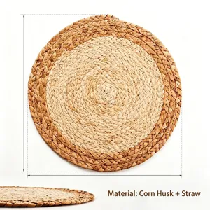 Close-up of hand-woven corn husk and straw placemat with natural texture details.