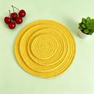 Yellow woven cotton rope placemat set with dynamic cherry prop background