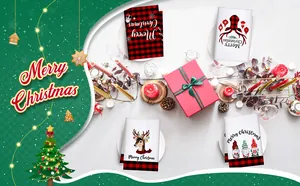 Set of microfiber Christmas kitchen towels with festive reindeer and gnome prints on table