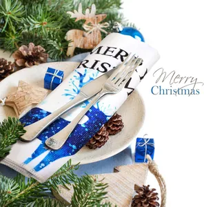 Detailed view of microfiber Christmas kitchen towel with blue reindeer print and text