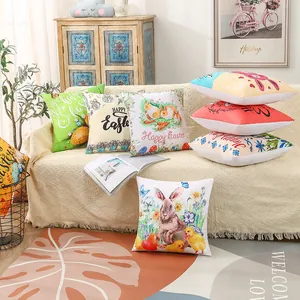Detailed shot of various Easter rabbit and egg patterns on decorative sofa pillow covers
