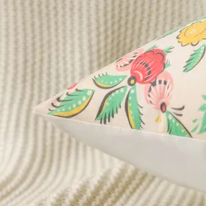 Detailed close-up of a floral Easter cushion cover with colorful printed patterns
