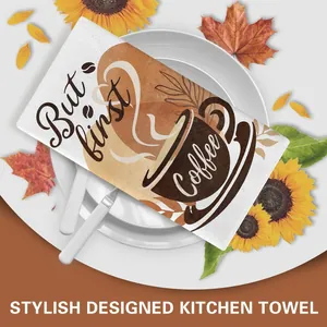 Detailed macro view of stylish kitchen towel featuring coffee print and decorative text