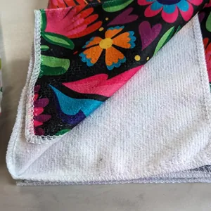 Macro detail of absorbent white terry cloth backing on floral printed kitchen towel