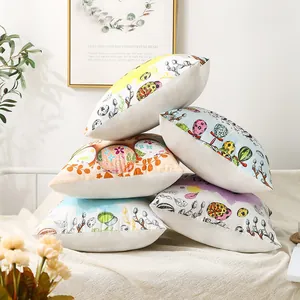 Decorative Easter throw pillow covers with colorful egg patterns on a white sofa.