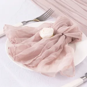 Soft pink cheesecloth gauze napkin with white rose decor for elegant wedding table setting