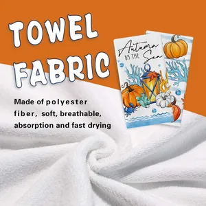 Close-up detail of soft white polyester fiber towel with autumn pumpkin design
