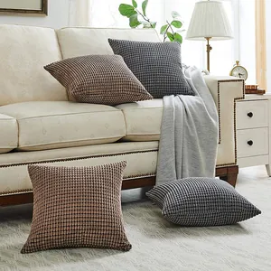 Detailed view of corn kernel corduroy pillow covers in a modern living room setting.