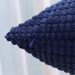 Close-up of navy blue corn grain corduroy cushion cover with hidden zipper detail
