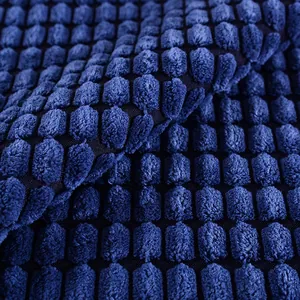 Detailed macro view of navy blue corn kernel textured corduroy fabric for home cushions.