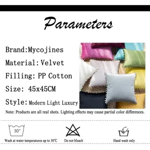 Detail view of velvet pom-pom pillowcases with size chart and washing instructions