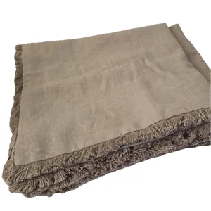 Solid taupe natural linen cushion cover featuring boho fringe trim for sofa decoration