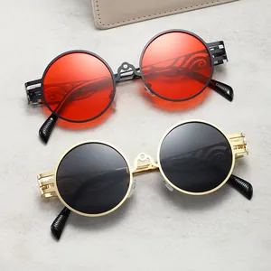 Lunettes de soleil rondes steampunk vintage avec design unique de branches en métal évidé.