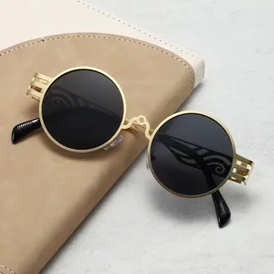 Lunettes de soleil rondes steampunk rétro en métal avec larges branches ajourées