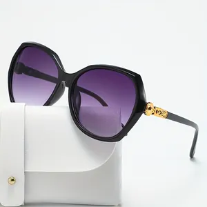 Stylish oversized polygon sunglasses featuring purple gradient lenses and decorative gold temples