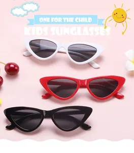 Stylish kids cat-eye sunglasses in white, red and black colors, perfect for summer fashion.