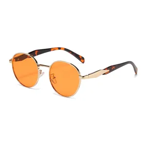 Retro-Sonnenbrille mit rundem Rahmen, orangefarbenen Gläsern und Goldgestell