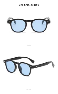 Retro round frame sunglasses with light blue lenses and silver studs in black finish