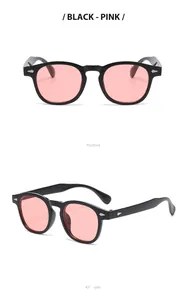 Retro round sunglasses with black frames and pink lenses, featuring silver rivets