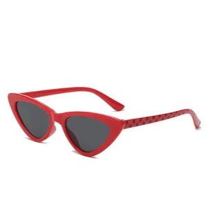 Red cat-eye children's sunglasses with triangle frame and star pattern temples