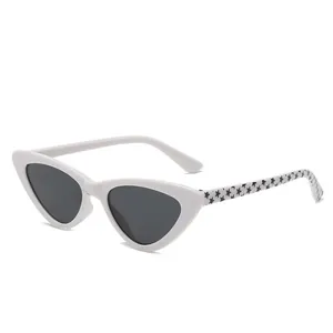 Retro white cat-eye sunglasses for kids with star pattern temple and protective black lenses