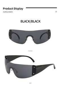 Detailed views of black Y2K star-studded futuristic rimless wrap-around sunglasses.