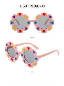 Vista dettagliata frontale e laterale degli occhiali da sole a fiore rosa per bambini.