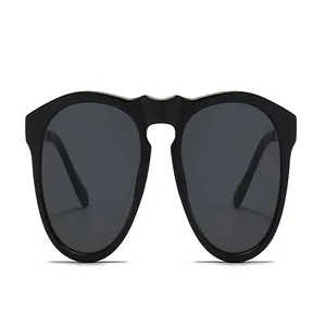 Trendy oversized black sunglasses with modern minimalist design and metal bridge detail.
