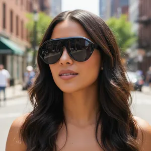 Close-up of oversized black Y2K sunglasses with cyberpunk futuristic design on model