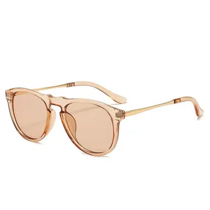 Stylish oversized women's sunglasses with champagne transparent frames and metal temples
