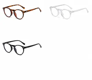 Detail of vintage round sunglasses in hawksbill, transparent, and bright black finishes.