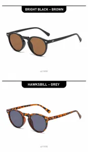 Detail view of vintage round sunglasses with bright black and tortoiseshell frames.