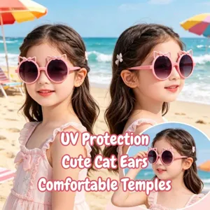 Detailed view of pink cat ear sunglasses for kids featuring cute bow accents and UV protection