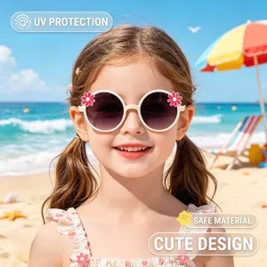 Close-up view of cute flower decorated children sunglasses on a girl at the beach