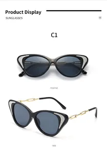 Λεπτομερείς όψεις μαύρων γυαλιών ηλίου cat-eye με κομψούς χρυσούς βραχίονες αλυσίδας