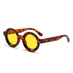 Vintage round frame sunglasses with tortoiseshell pattern and yellow tinted lenses