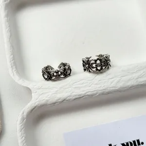 Macro view of vintage Thai silver rings with intricate carvings and small stones