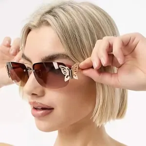 Vintage rimless butterfly sunglasses featuring brown gradient lenses on model face