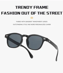 Close-up of retro round frame sunglasses with classic silver rivet accents