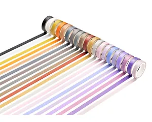 Detail view of colorful solid washi tape rolls showing vibrant rainbow gradient rows