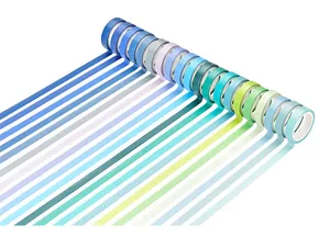 Detail view of multi-color washi tape rolls arranged in a gradient rainbow layout