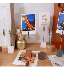 Detailed view of colorful wooden cube base crocodile clips for photos and desk memos