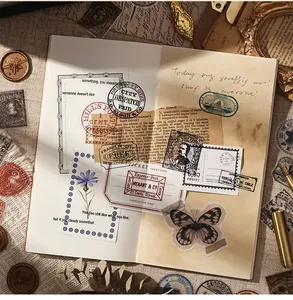 Vintage postmark stickers showing butterfly and flower patterns in a detailed scrapbook