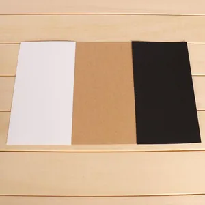 Detail showing the textures of white, brown, and black thick Kraft cardstock pieces