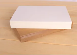 Close-up of thick blank white and kraft brown cardstock for DIY crafts and painting