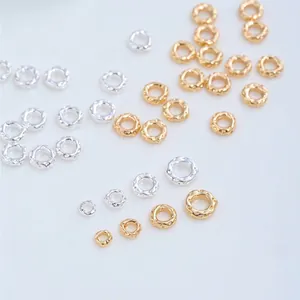 Detailed view of 14K gold-filled and silver textured spacer beads for DIY jewelry